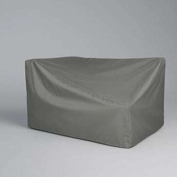 Gray rectangular outdoor furniture cover on a gray background