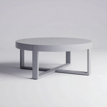 Round coffee table with a minimalist design on a plain background