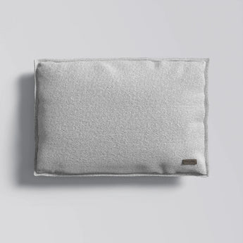 Gray textured pillow on a light gray background