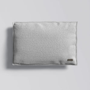 Gray textured pillow on a light gray background