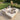Woman relaxing with a dog on TroisPommes Home The Daybed on a wooden deck